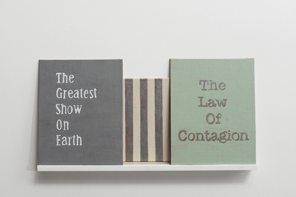 3 text paintings on a shelf by Lynne Barwick